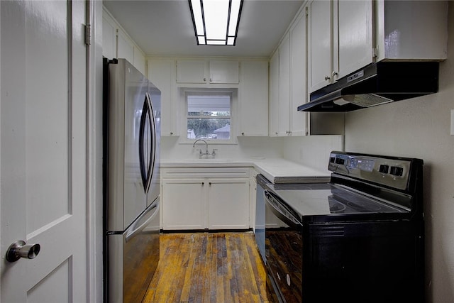 kitchen featuring stainless steel refrigerator, white cabinetry, sink, and black electric range oven