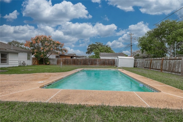 view of swimming pool featuring a yard and a patio