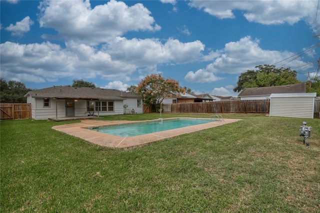 view of swimming pool featuring a patio and a lawn