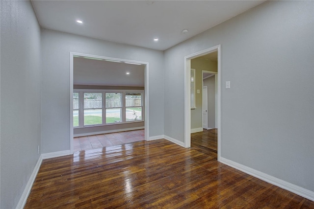 empty room featuring dark wood-type flooring