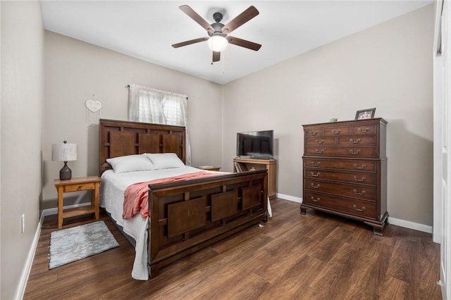 bedroom featuring ceiling fan and dark wood-type flooring