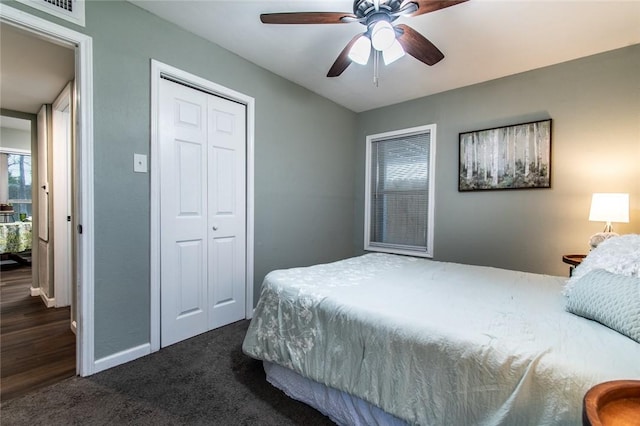 950 Susan Dr, Corpus Christi, TX 78412 - bedroom with a closet, dark carpet, baseboards, and a ceiling fan