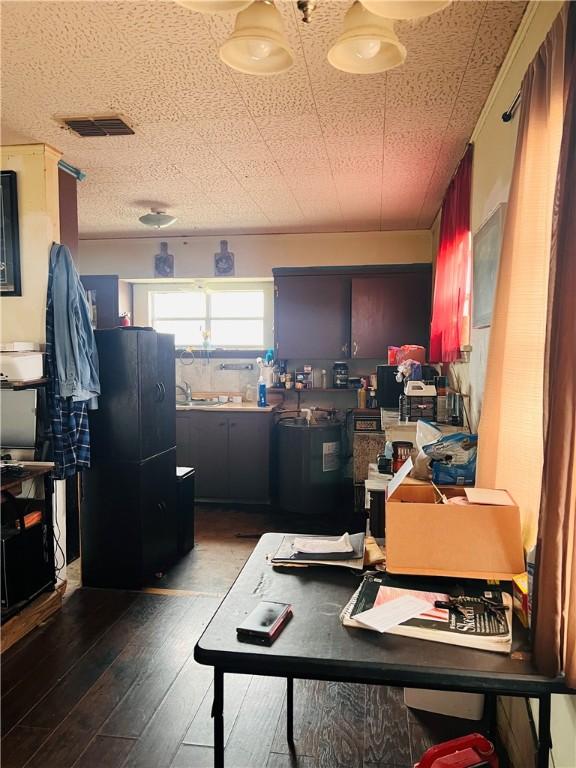 office with dark wood-type flooring