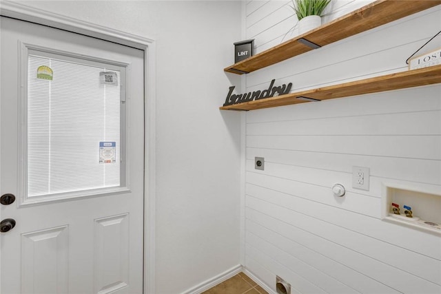 washroom with electric dryer hookup, hookup for a washing machine, and tile patterned floors