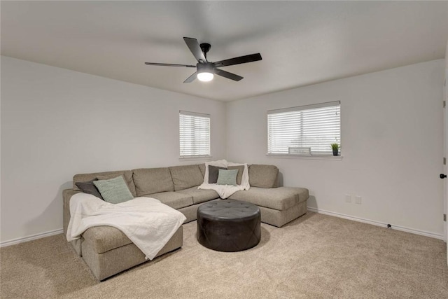 living room with ceiling fan and light carpet