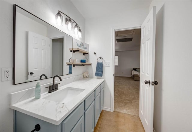 bathroom with tile patterned floors and vanity