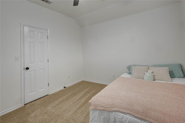 carpeted bedroom with ceiling fan and lofted ceiling