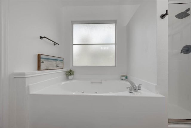 bathroom featuring separate shower and tub