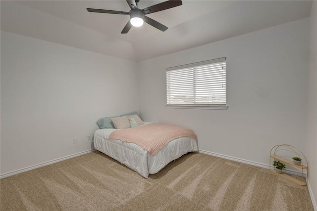 carpeted bedroom featuring ceiling fan and lofted ceiling