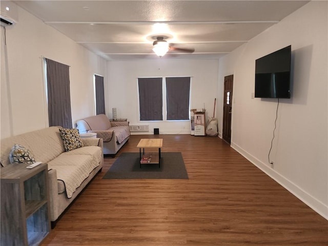 1613 6th St, Corpus Christi, TX 78404 - living area with a wall mounted air conditioner, wood finished floors, baseboards, and ceiling fan