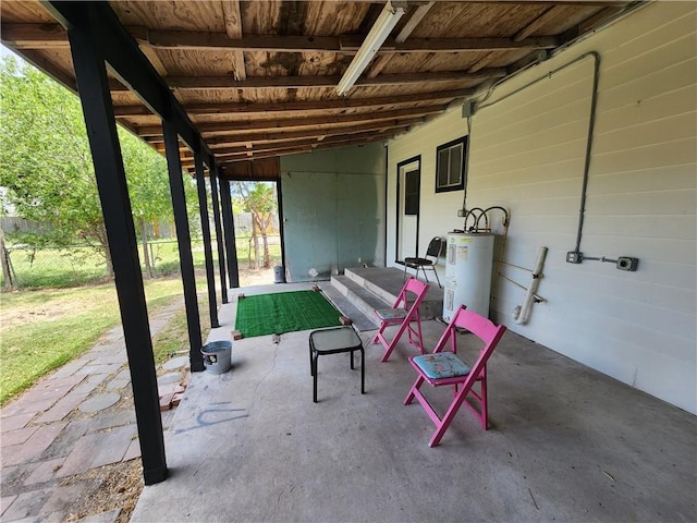 1613 6th St, Corpus Christi, TX 78404 - view of patio featuring electric water heater and fence