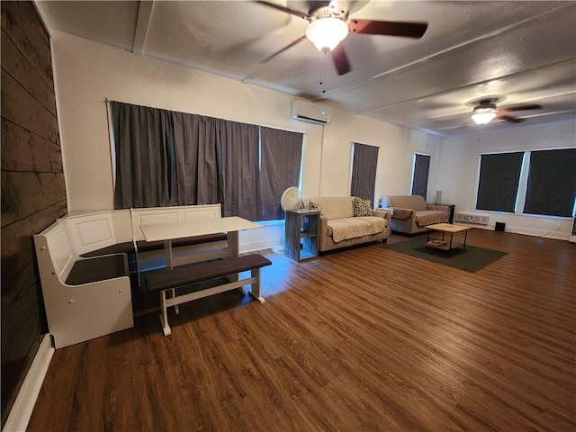 1613 6th St, Corpus Christi, TX 78404 - living room featuring a wall mounted air conditioner, a ceiling fan, and wood finished floors