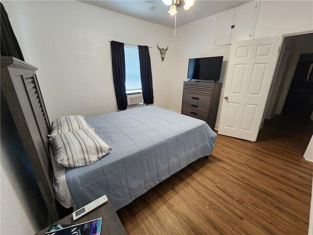 1613 6th St, Corpus Christi, TX 78404 - bedroom with wood finished floors and cooling unit
