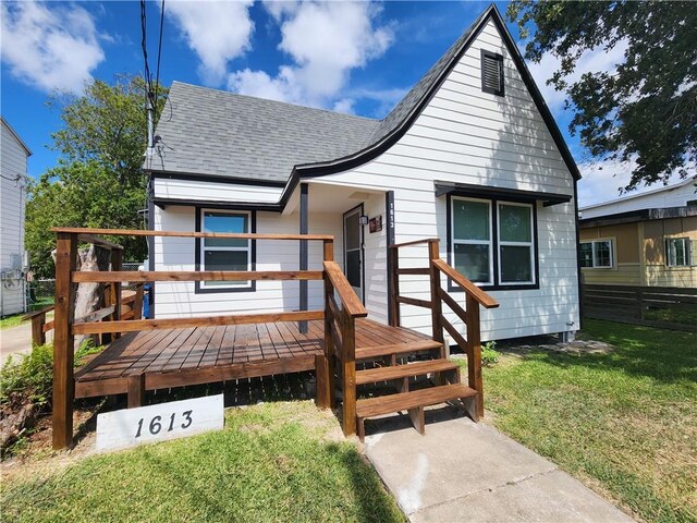 1613 6th St, Corpus Christi, TX 78404 - view of front of house with a shingled roof and a deck