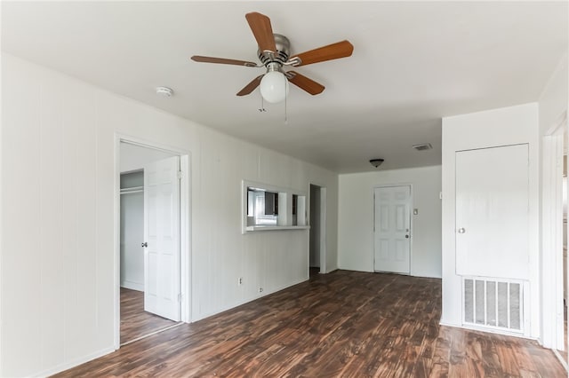 unfurnished room featuring dark hardwood / wood-style floors and ceiling fan