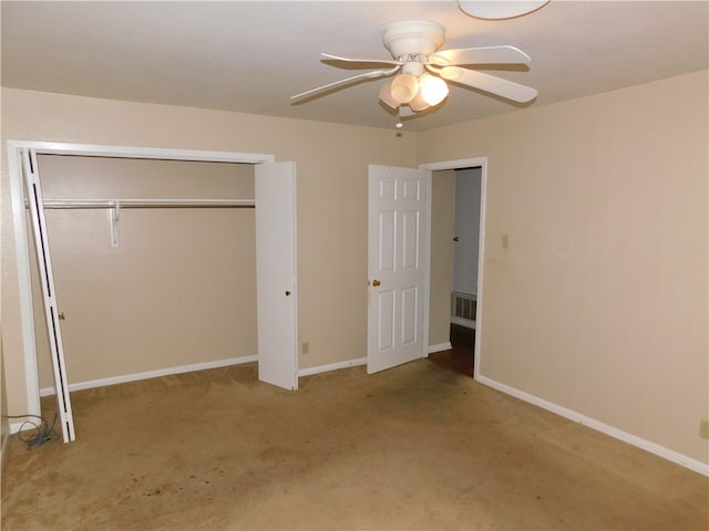unfurnished bedroom with light carpet, ceiling fan, and a closet