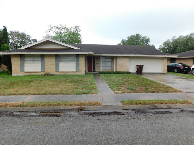 view of front of property with a garage and a front yard
