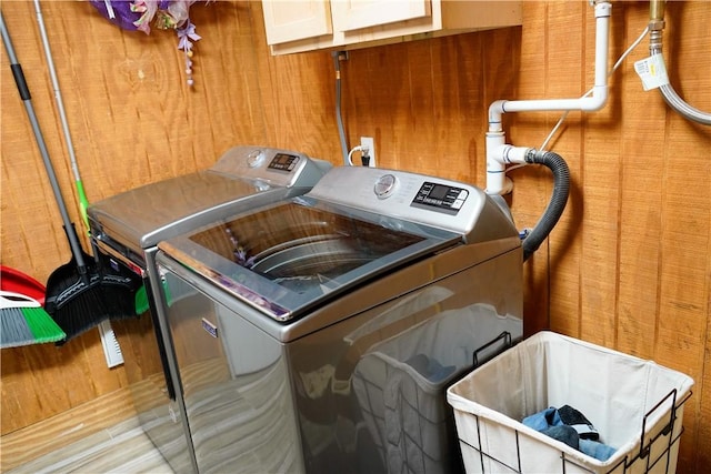 1508 Roosevelt Dr, Alice, TX 78332 - laundry room with washer and clothes dryer and cabinet space