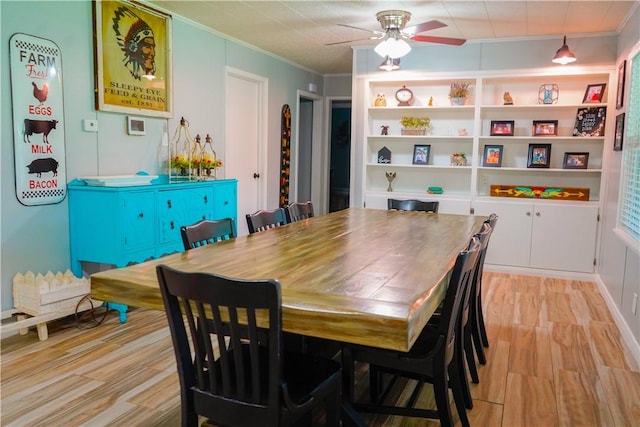 1508 Roosevelt Dr, Alice, TX 78332 - dining space with crown molding, a ceiling fan, and light wood-style floors