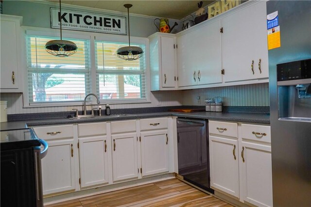 1508 Roosevelt Dr, Alice, TX 78332 - kitchen with stainless steel fridge, dishwashing machine, stove, white cabinets, and dark countertops