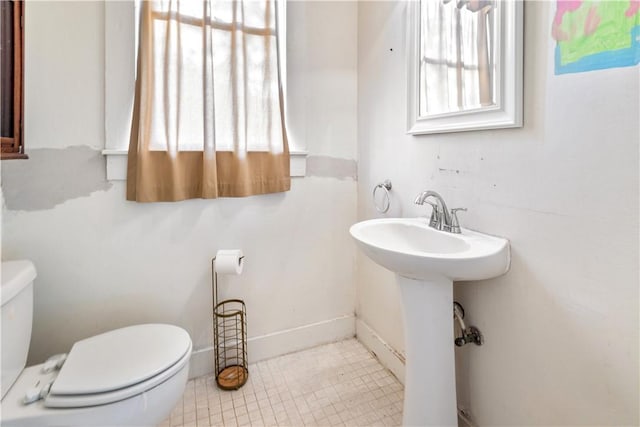 bathroom featuring toilet and a sink