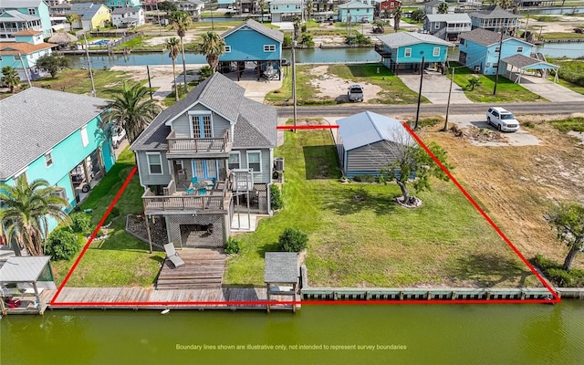 bird's eye view featuring a residential view and a water view