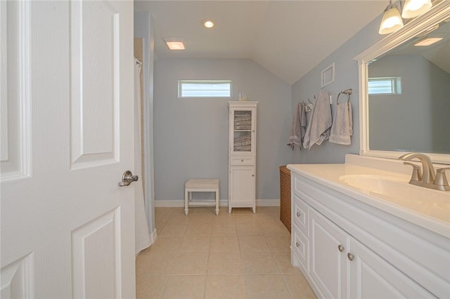 full bathroom featuring tile patterned flooring, visible vents, vanity, and lofted ceiling