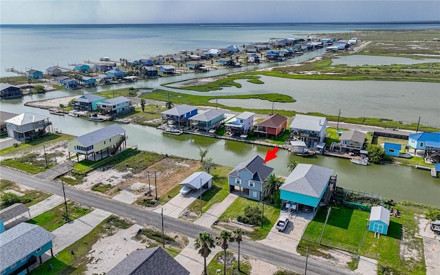 aerial view featuring a water view and a residential view