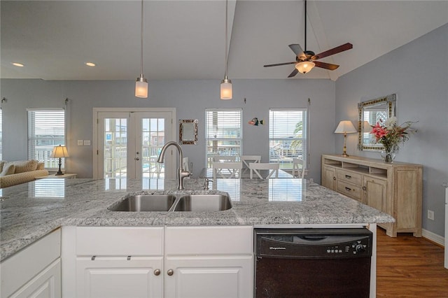 kitchen featuring open floor plan, dishwasher, french doors, wood finished floors, and a sink