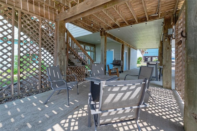 view of patio / terrace featuring stairway and grilling area