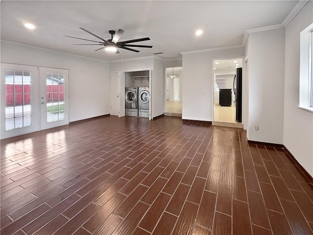 unfurnished living room featuring crown molding, separate washer and dryer, dark wood finished floors, and french doors