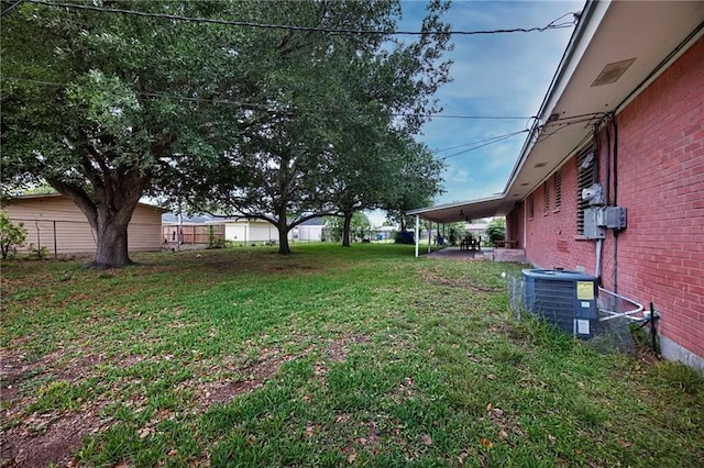 view of yard with cooling unit and a patio area