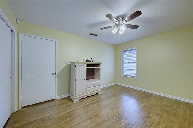 unfurnished bedroom featuring light hardwood / wood-style flooring and ceiling fan