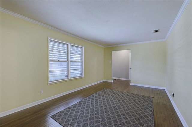 empty room with dark hardwood / wood-style floors and ornamental molding