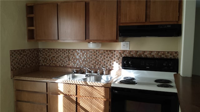 kitchen with white electric range oven, backsplash, sink, and exhaust hood