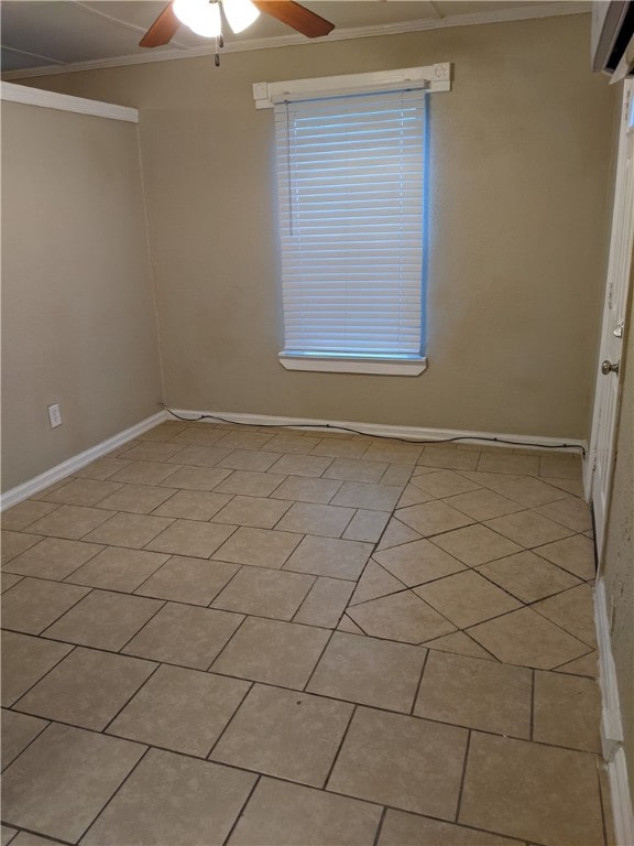 unfurnished room featuring light tile patterned floors, ceiling fan, and ornamental molding