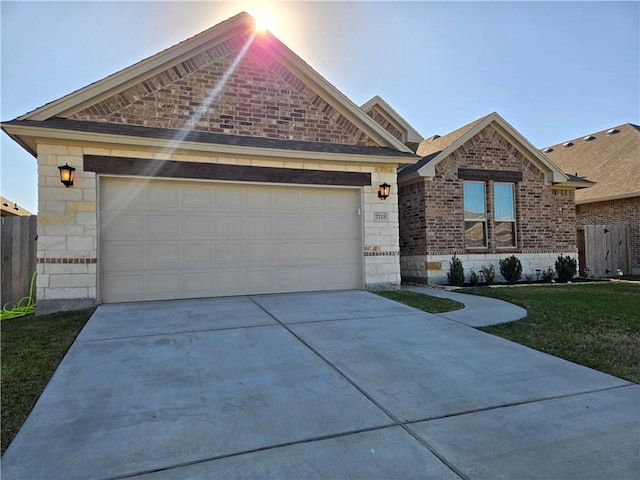 view of front of property featuring a front lawn and a garage