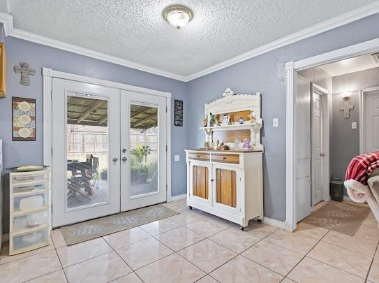 doorway to outside featuring french doors, crown molding, light tile patterned flooring, and a textured ceiling