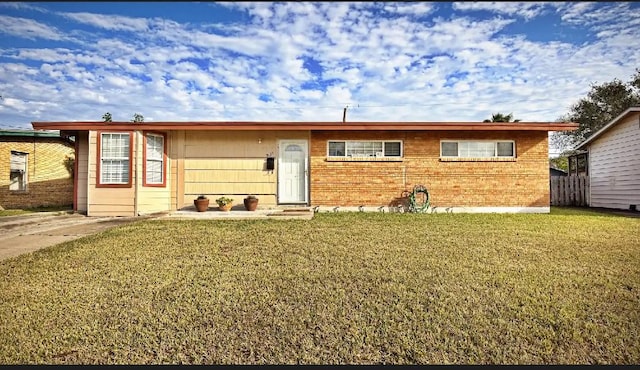 ranch-style home featuring a front yard