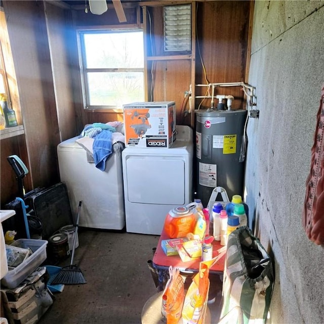 laundry room with laundry area, independent washer and dryer, and electric water heater