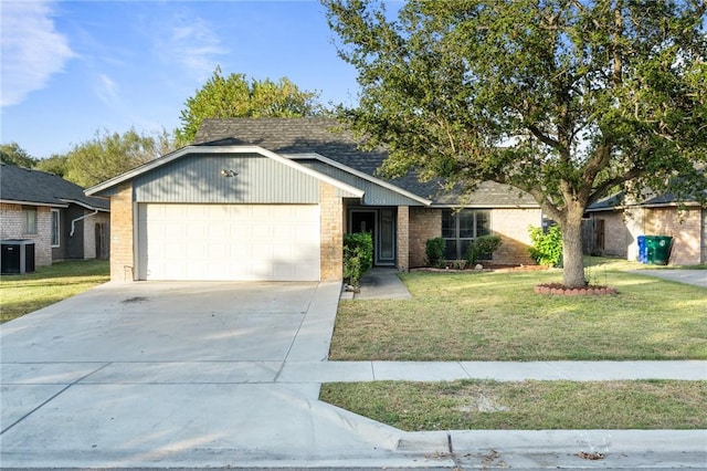 ranch-style house with a front yard, central AC, and a garage