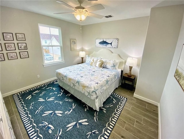 bedroom with ceiling fan and hardwood / wood-style flooring