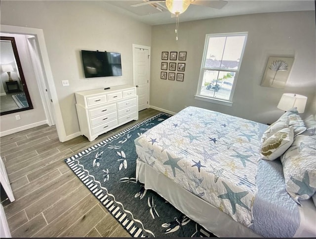 bedroom featuring wood-type flooring and ceiling fan