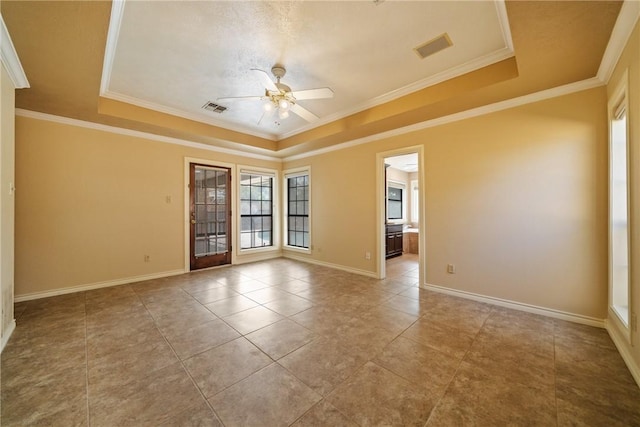 5305 Hunt Cir, Corpus Christi, TX 78413 - empty room with ceiling fan, tile patterned flooring, a raised ceiling, and crown molding