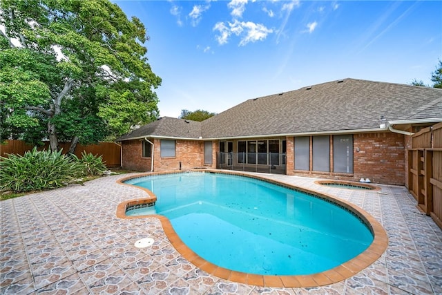 5305 Hunt Cir, Corpus Christi, TX 78413 - view of pool featuring an in-ground hot tub, a fenced backyard, a patio area, and a sunroom