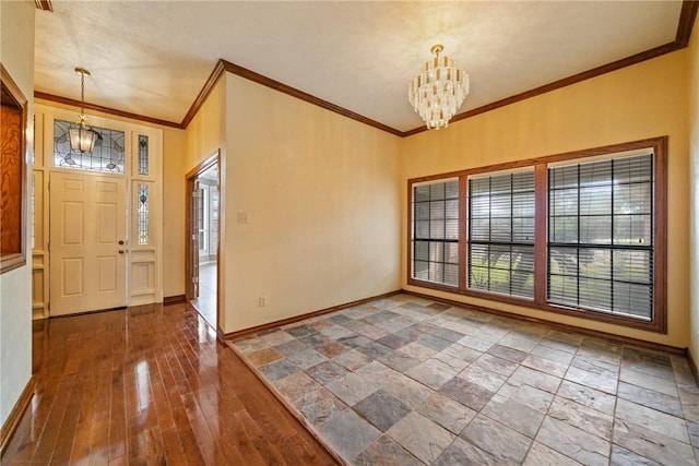5305 Hunt Cir, Corpus Christi, TX 78413 - foyer entrance featuring a chandelier and ornamental molding