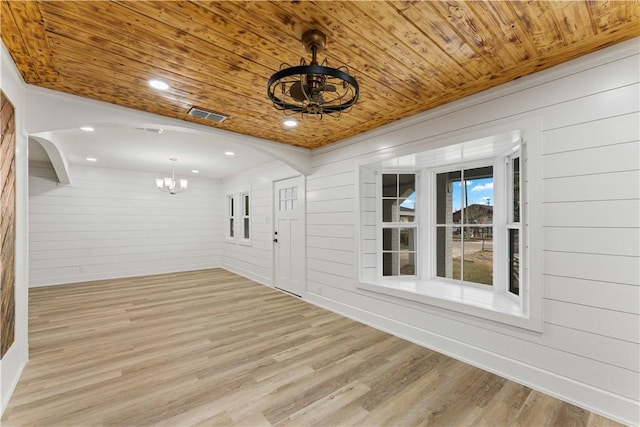 interior space featuring wood ceiling and an inviting chandelier