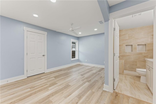 interior space with ceiling fan and light hardwood / wood-style floors