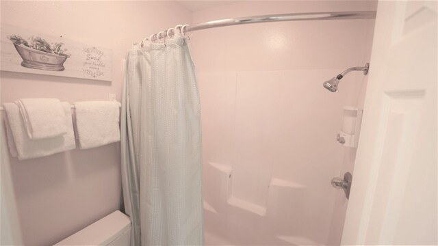 bathroom with a shower with shower curtain