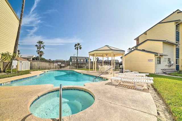 view of swimming pool featuring cooling unit, a gazebo, a community hot tub, and a patio